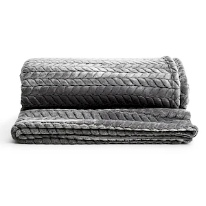 Torkkupeitto lahjapaketissa Lehti